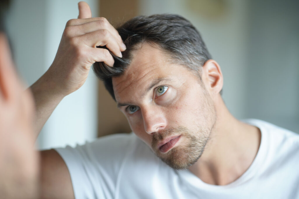 portrait of a man worried about hair loss